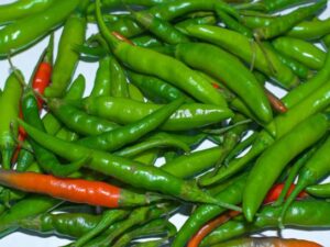 green & red chili close up background texture image.