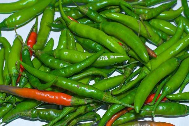 green & red chili close up background texture image. green & red chili close up background texture image.